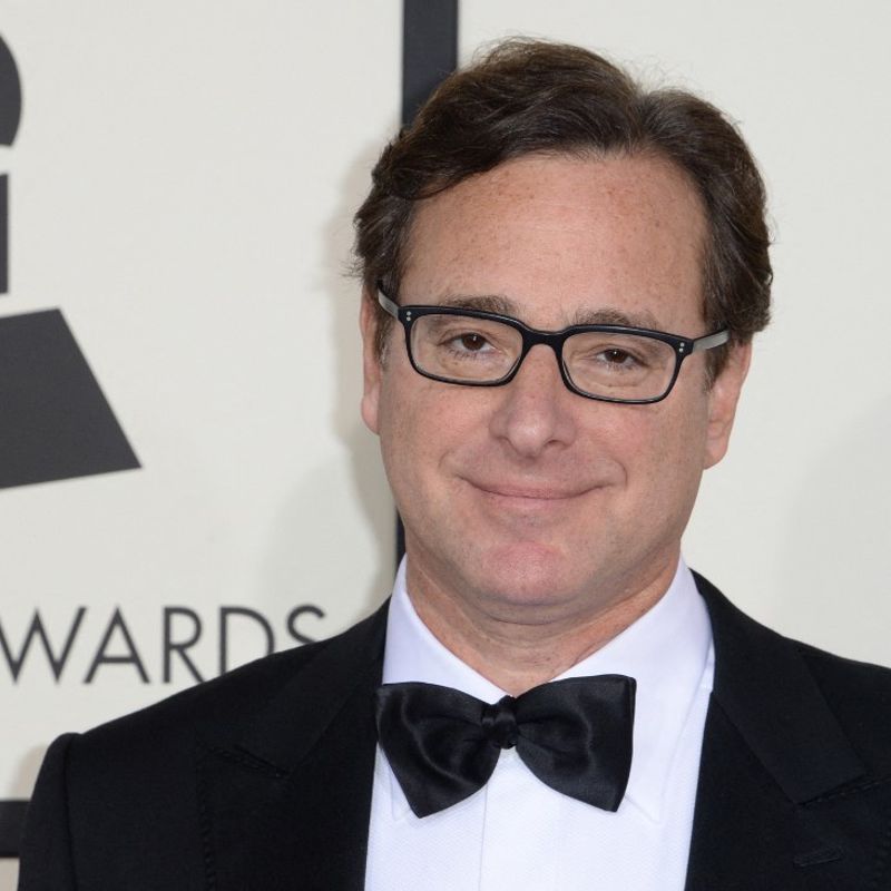 (FILES) In this file photo taken on January 26, 2014 Bob Saget arrives on the red carpet for the 56th Grammy Awards at the Staples Center in Los Angeles, California. - Bob Saget, the US comedian who delighted millions as the star of television's "Full House" in the 1980s and 1990s, has been found dead in a Florida hotel room, the local sheriff said on January 9, 2022. (Photo by Robyn BECK / AFP)