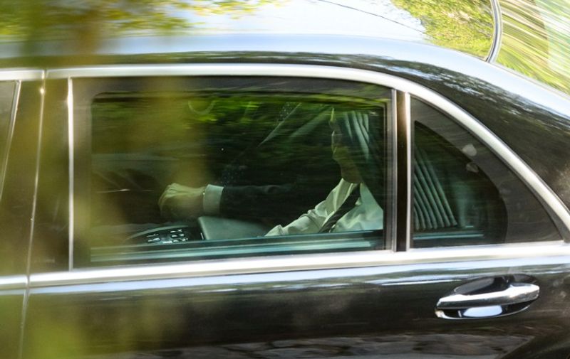 Russian President Vladimir Putin is seen in a car as he leaves a ceremony at a Russian Chapel at the Vrsic mountain pass in northern Slovenia, on July 30, 2016 marking the centenary of the killing of some 300 Russian prisoners of war by an avalanche in 1916.
Russian President Vladimir Putin avoided any public mention of current tensions with the West as he paid a visit on July 30 to European Union and NATO member Slovenia, focusing on history not politics. / AFP PHOTO / Jure MAKOVEC