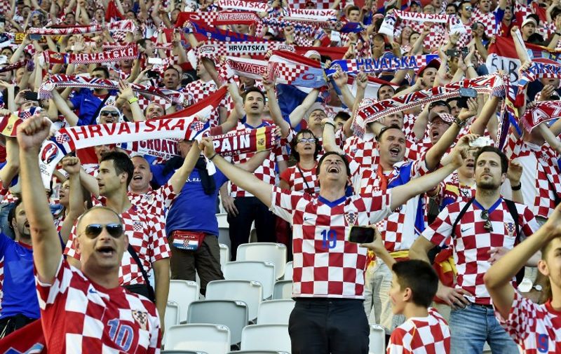 Croatia supporters wave scarves during the Euro 2016 group D football match between Croatia and Spain at at the Matmut Atlantique stadium in Bordeaux on June 21, 2016. / AFP PHOTO / GEORGES GOBET