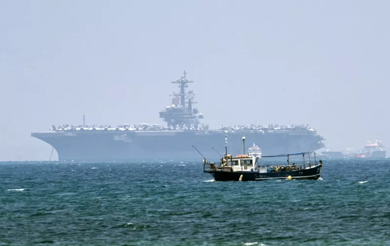 The aircraft carrier USS George H.W. Bush is seen moored in the Mediterranean Sea off the Israeli port of Haifa on July 1, 2017. - The 1,092 feet (333 metres) carrier which can carry 6,000 personnel, is one of the worlds largest warships. (Photo by JACK GUEZ / AFP)