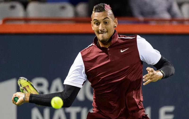 MONTREAL, ON - AUGUST 12: Nick Kyrgios of Australia hits a return against Stan Wawrinka of Switzerland during day three of the Rogers Cup at Uniprix Stadium on August 12, 2015 in Montreal, Quebec, Canada.   Minas Panagiotakis/Getty Images/AFP