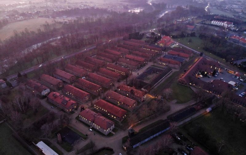 An aerial picture taken on December 15, 2019 in Oswiecim, Poland, shows buildings of Auschwitz I, which were part of former German Nazi death camp Auschwitz-Birkenau. The site has been turned into a museum and memorial site. - The Auschwitz camp was established by the Nazis in 1940, in the suburbs of the city of Oswiecim which, like other parts of Poland, was occupied by the Germans during the Second World War. The name of the city of Oswiecim was changed to Auschwitz, which became the name of the camp as well. Over the following years, the camp was expanded and consisted of three main parts: Auschwitz I, Auschwitz II-Birkenau, and Auschwitz III-Monowitz. (Photo by Pablo GONZALEZ / AFP)