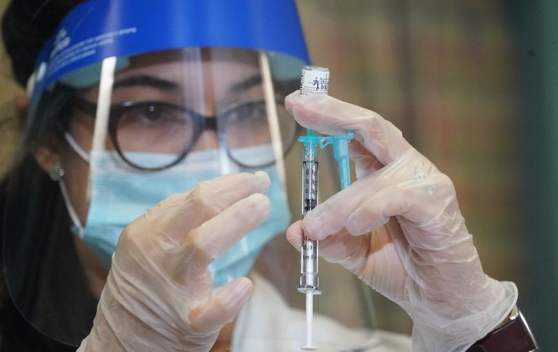 Walgreens pharmacist Jessica Sahni prepares a Pfizer Covid-19 vaccine at The New Jewish Home long-term care facility on Manhattans Upper West Side in New York on December 21, 2020. (Photo by Bryan R. Smith / AFP)
