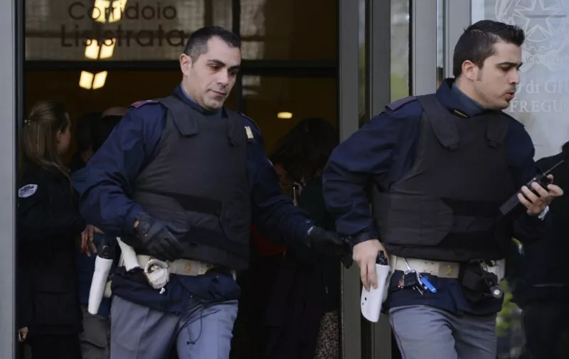 Police officers run outside Milan&#8217;s court on April 9,2015. An armed man, identified as Claudio Giardiello, believed to be a defendant in a bankruptcy case shot two people dead, including a judge, on the third floor of the Milan court. The sound of shots sparked panic in the court, with lawyers fleeing the scene while [&hellip;]