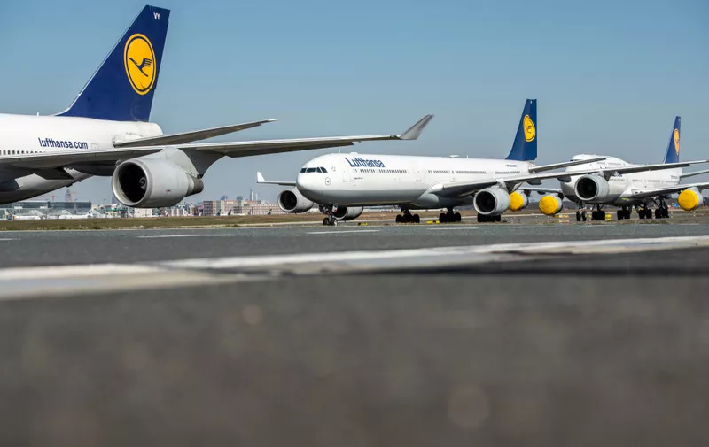 FRANKFURT AM MAIN, GERMANY - MARCH 25: Passenger planes of German airline Lufthansa stand parked and pulled from service at Frankfurt Airport on March 25, 2020 in Frankfurt, Germany. Lufthansa is setting aside 700 of its 763 planes due to a collapse in reservations and passenger numbers due to the worldwide effects of the coronavirus. Airports across the globe have closed, governments have imposed severe restrictions at borders and tourism has come to a halt. (Photo by Thomas Lohnes/Getty Images)