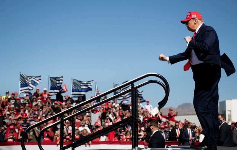 US President Donald Trump dances as he leaves after speaking during a Make America Great Again rally at Laughlin/Bullhead International Airport October 28, 2020, in Bullhead City, Arizona. (Photo by Brendan Smialowski / AFP)