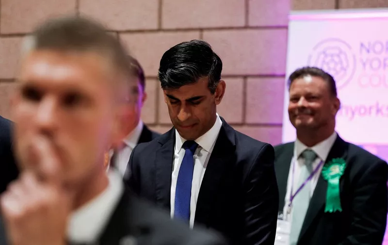 Britain's Prime Minister and Conservative Party leader Rishi Sunak reacts after retaining his seat as MP for Richmond and Northallerton in Northallerton, north of England, early on July 5, 2024. Britain's main opposition Labour party looks set for a landslide election win, exit polls indicated, with Keir Starmer replacing Rishi Sunak as prime minister, ending 14 years of Conservative rule. (Photo by Temilade Adelaja / POOL / AFP)