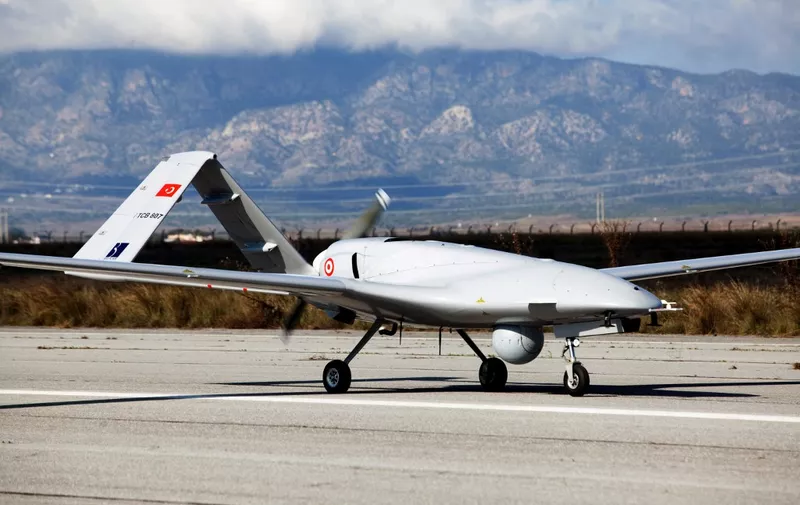 The Turkish-made Bayraktar TB2 drone is pictured on December 16, 2019 at Gecitkale military airbase near Famagusta in the self-proclaimed Turkish Republic of Northern Cyprus (TRNC). - The Turkish military drone was delivered to northern Cyprus amid growing tensions over Turkey's deal with Libya that extended its claims to the gas-rich eastern Mediterranean. The Bayraktar TB2 drone landed in Gecitkale Airport in Famagusta around 0700 GMT, an AFP correspondent said, after the breakaway northern Cyprus government approved the use of the airport for unmanned aerial vehicles. It followed a deal signed last month between Libya and Turkey that could prove crucial in the scramble for recently discovered gas reserves in the eastern Mediterranean. (Photo by Birol BEBEK / AFP)