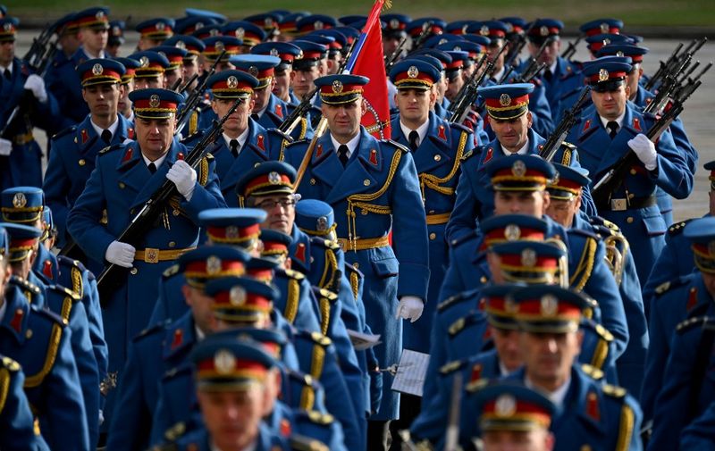 Serbian Army honor guard arrives for Italy's Prime Minister welcome ceremony before a meeting with Serbia's president in Belgrade on December 3, 2023. (Photo by Andrej ISAKOVIC / AFP)