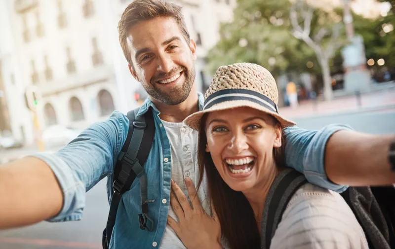 Happy couple, tourist and selfie in a city for travel on street with holiday memory and happiness. Portrait of man and woman outdoor on urban road for adventure, social media or vacation photo.,Image: 782006959, License: Royalty-free, Restrictions: , Model Release: yes
