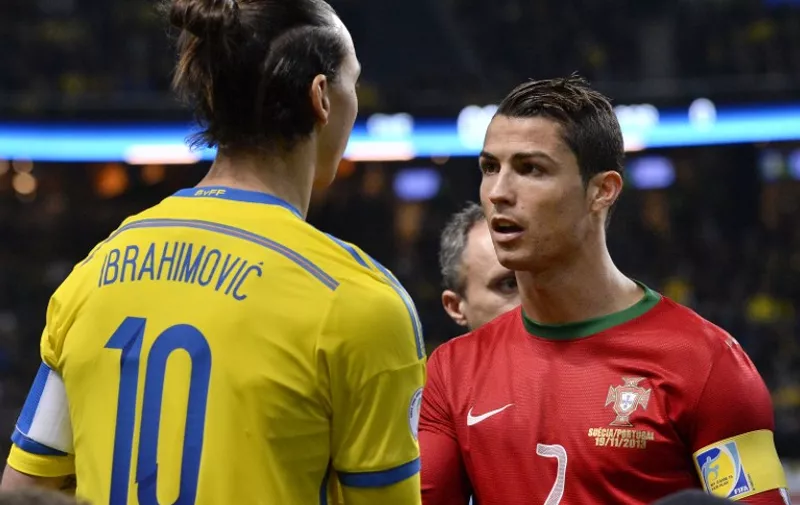 Sweden's forward Zlatan Ibrahimovic (L) shakes hands with Portugal's forward Cristiano Ronaldo prior to the FIFA 2014 World Cup playoff football match Sweden vs Portugal at the Friends Arena in Solna, near Stockholm on November 19, 2013. Portugal won the match 2-3 to secure their place at the World Cup in Brazil. AFP PHOTO/JONATHAN NACKSTRAND