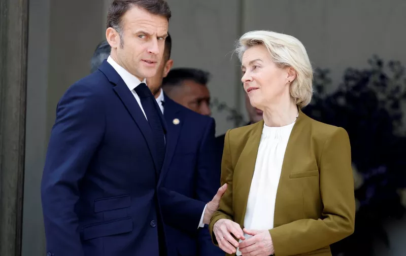 France's President Emmanuel Macron speaks with European Commission President Ursula von der Leyen as they leave after holding a trilateral meeting, which included the Chinese President, as part of the Chinese president's two-day state visit, at the Elysee Palace in Paris, on May 6, 2024. French President Emmanuel Macron is to host Xi Jinping for a state visit on May 6, 2024, seeking to persuade the Chinese leader to shift positions over Russia's invasion of Ukraine and also imbalances in global trade. Xi's first visit to Europe since 2019 will also see him hold talks in Serbia and Hungary. Xi has said he wants to find peace in Ukraine even if analysts do not expect major changes in Chinese policy. (Photo by Ludovic MARIN / AFP)