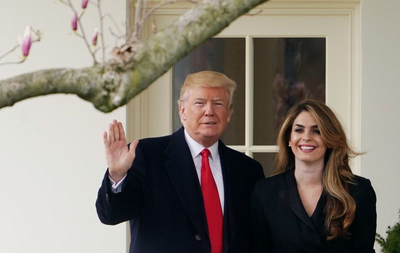 (FILES) In this file photo taken on March 29, 2018 US President Donald Trump poses with former communications director Hope Hicks shortly before making his way to board Marine One on the South Lawn and departing from the White House. - US President Donald Trump said on October 1, 2020 evening that he and the First Lady will quarantine as they await results from a test for Covid-19 after close advisor Hope Hicks tested positive for the disease. (Photo by Mandel NGAN / AFP)
