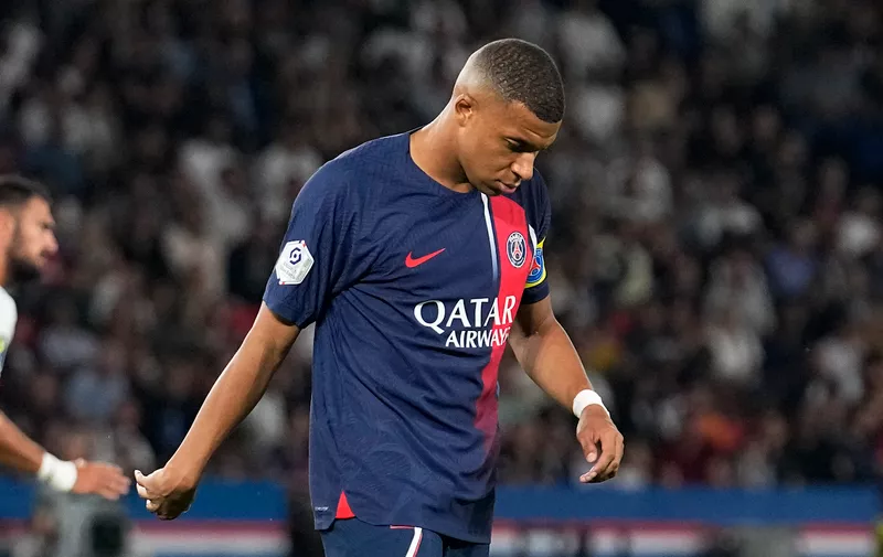 PSG's Kylian Mbappe reacts during the French League One soccer match between Paris Saint Germain and Nice at Parc des Princes stadium in Paris, Friday, Sept. 15, 2023. (AP Photo/Michel Euler)