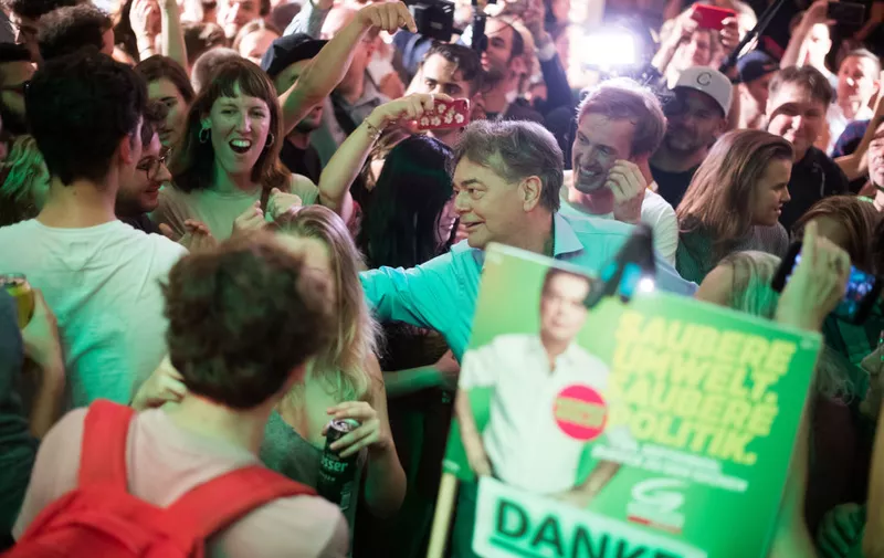 VIENNA, AUSTRIA - SEPTEMBER 29: Werner Kogler of the Austrian Greens Party arrives and celebrates with supporters at an election party of the Greens during the National Council elections on September 29, 2019 in Vienna, Austria. The elections are taking place following the so-called Ibiza affair, which brought down then Vice-Chancellor and leader of the FPOe, Heinz-Christian Strache, but also eventually led to the dissolution of the entire government. The Austrian People"u2019s Party of former Chancellor Sebastian Kurz is leading solidly in polls going into the election with the Social Democrats (SPOe) and Freedom Party (FPOe) in second and third place, respectively. In fourth place and with likely the biggest points gain is the Austrian Greens party. (Photo by Michael Gruber/Getty Images)