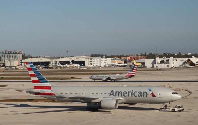 American Airlines jetliners are pictured February 3, 2019 at Miami International Airport in Florida. (Photo by Daniel SLIM / AFP)