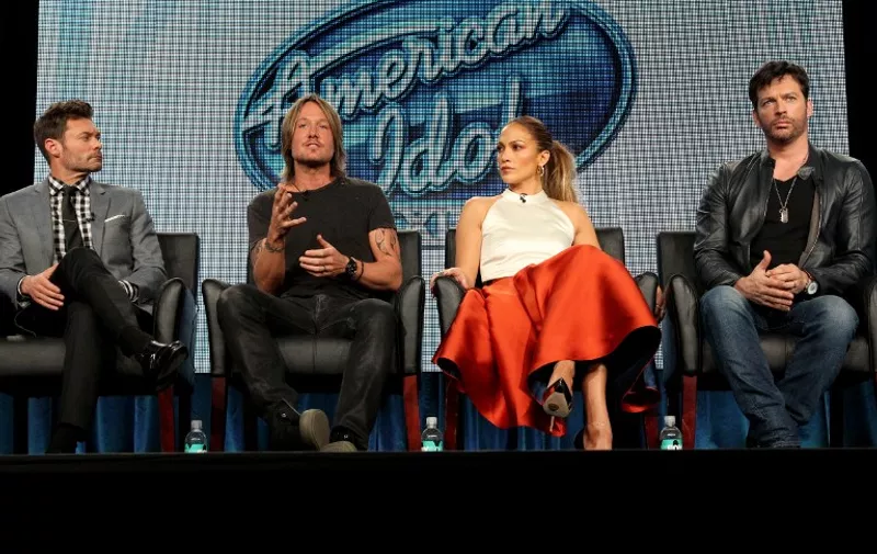 PASADENA, CA - JANUARY 17: (L-R) Host Ryan Seacrest, musician/judge Keith Urban, singer/actress/judge Jennifer Lopez and musician/actor/judge Harry Connick, Jr. speak onstage during the 'American Idol' panel discussion at the FOX portion of the 2015 Winter TCA Tour at the Langham Hotel on January 17, 2015 in Pasadena, California.   Frederick M. Brown/Getty Images/AFP