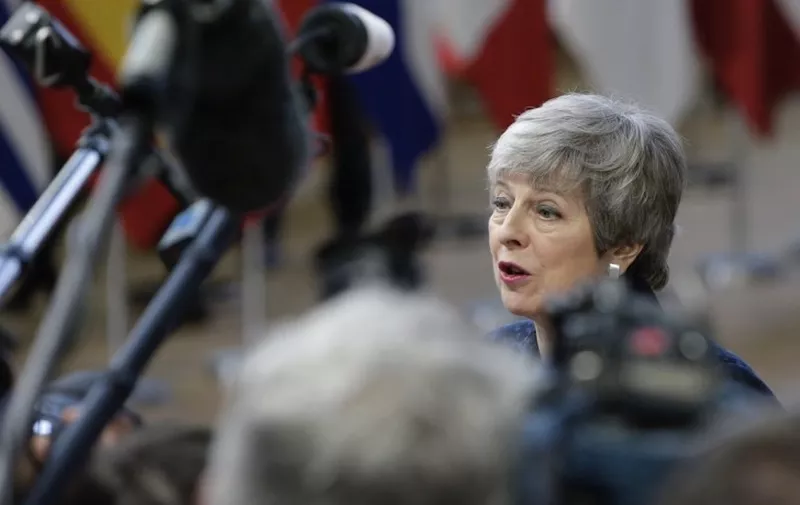 Britain's Prime Minister Theresa May speaks to the press as she arrives on March 21, 2019 in Brussels on the first day of an EU summit focused on Brexit. - European Union leaders meet in Brussels on March 21 and 22, for the last EU summit before Britain's scheduled exit of the union. (Photo by Aris Oikonomou / AFP)