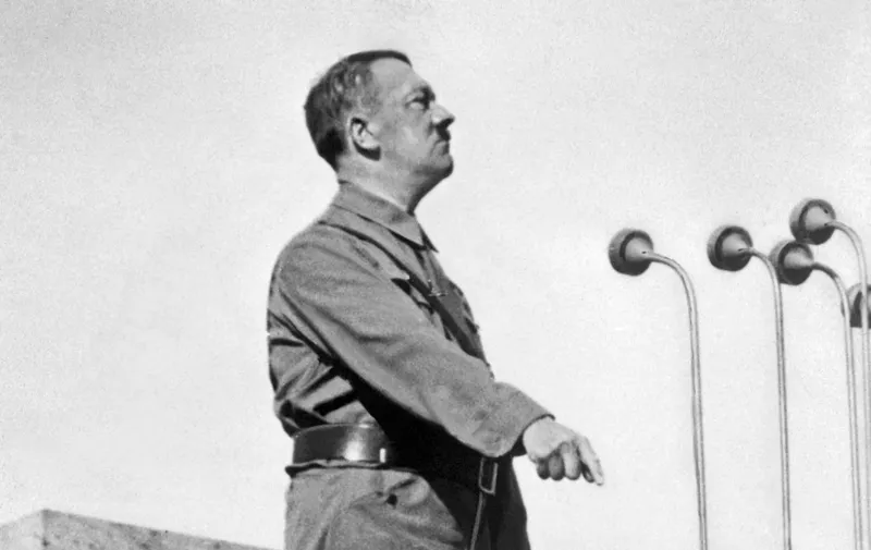 German Nazi Chancellor Adolf Hitler (1889-1945) gives a speech in 1937 in an unidentified place. After Hitler was made Chancellor in January 1933 he suspended the constitution, silenced opposition, exploited successfully the burning of the Reichstag (Parliament) building, and brought the Nazi Party to power. (Photo by FRANCE PRESSE VOIR / AFP)