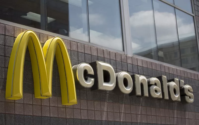The McDonald's logo is seen outside a restaurant in Washington, DC, on July 9, 2019. (Photo by Alastair Pike / AFP)