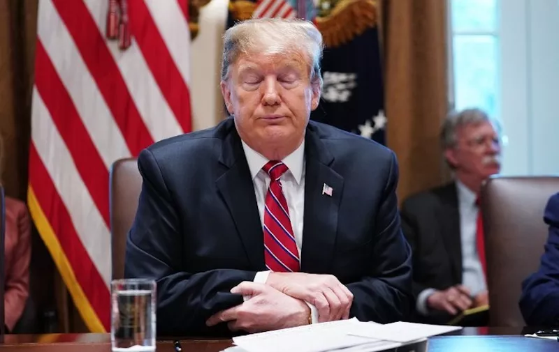 US President Donald Trump speaks during a cabinet meeting in the Cabinet Room of the White House in Washington, DC on February 12, 2019. - US President Donald Trump on Tuesday said he wasn't "happy" with a preliminary deal by US lawmakers to provide funding for a border wall with Mexico but added another government shutdown was not likely. "I can't say I'm happy, I can't say I'm thrilled," he told a cabinet meeting in the White House.But he indicated he could supplement the offer from Congress from other sources and lay the dispute to rest. (Photo by MANDEL NGAN / AFP)