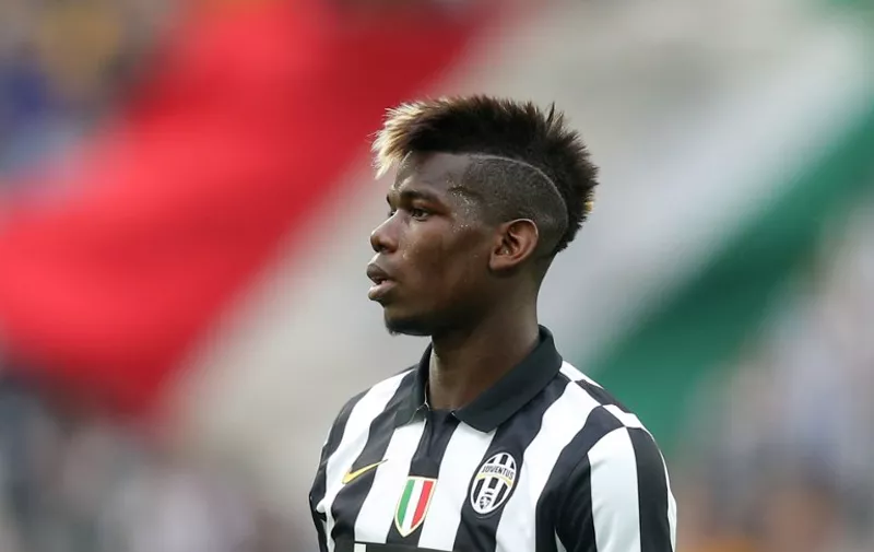 Juventus' midfielder from France Paul Pogba looks on during the Italian Serie A football match Juventus vs Napoli on May 23, 2015 at the Juventus stadium in Turin.   AFP PHOTO / 