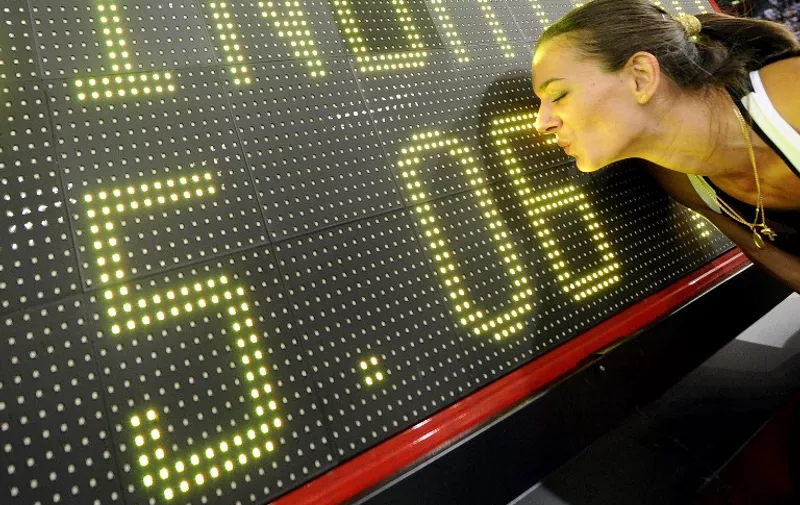Yelena Isinbayeva of Russia celebrates her new World Record of 5.06 metres in Pole Vault at the Zurich IAAF Golden League athletics meeting on August 28, 2009 in Zurich. Isinbayeva roared back to the top of the women's pole vaulting charts after her disastrous Berlin world championships campaign by setting a new world record of 5.06 metres. AFP PHOTO/FABRICE COFFRINI