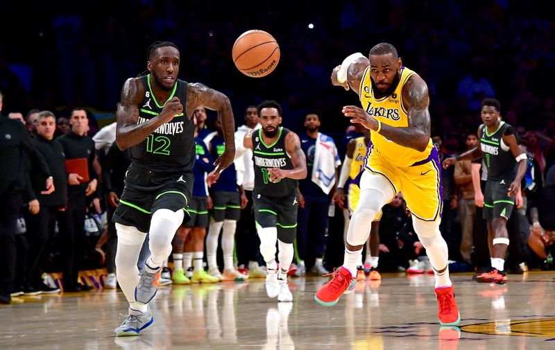 Apr 11, 2023; Los Angeles, California, USA; Los Angeles Lakers forward LeBron James (6) chases for the ball against Minnesota Timberwolves forward Taurean Prince (12) during the second half at Crypto.com Arena. Mandatory Credit: Gary A. Vasquez-USA TODAY Sports