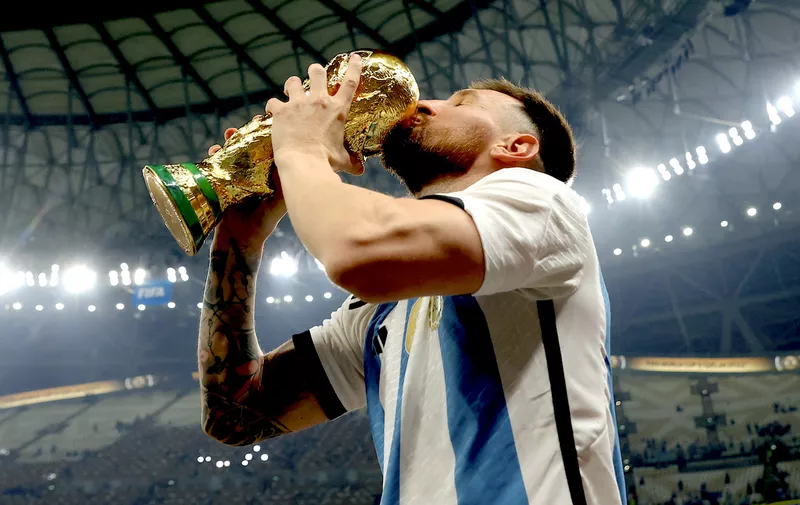 Soccer Football - FIFA World Cup Qatar 2022 - Final - Argentina v France - Lusail Stadium, Lusail, Qatar - December 18, 2022 
 Argentina's Lionel Messi kisses the trophy as he celebrates winning the World Cup REUTERS/Hannah Mckay