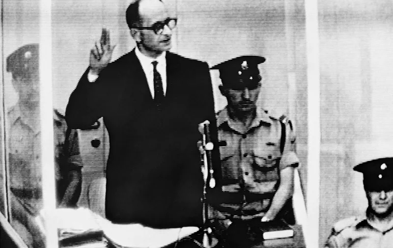 Nazi leader and war criminal Adolf Eichmann takes oath on May 5, 1961 during his trial in front of an Israeli Court in Jerusalem. He was sentenced to death and executed in Jerusalem on May 30, 1962. AFP PHOTO (Photo by AFP)