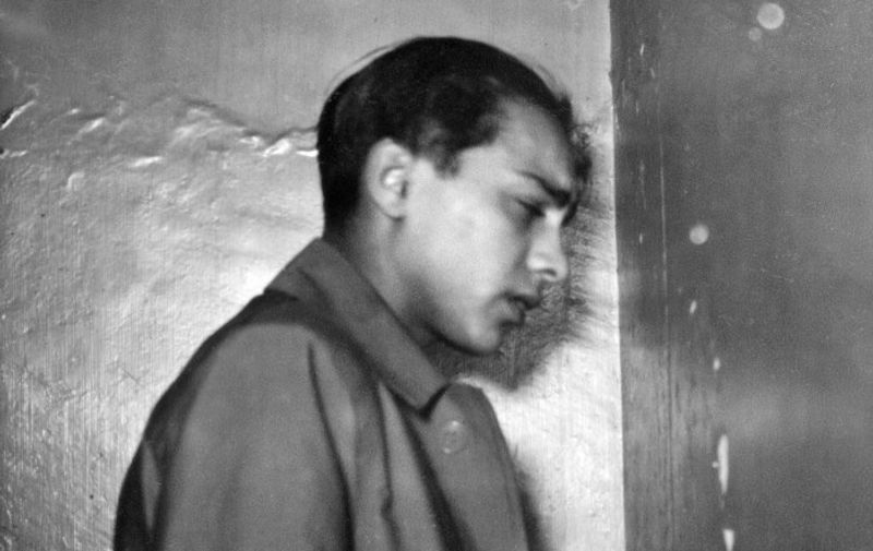 Herschel Grynszpan pictured 02 December 1938 on his way to Paris court. Grynszpan, a 16-year old Polish-Jewish who lived in Paris, shot dead Ernst Vom Rath, a junior German diplomat, 07 November 1938, in German embassy in France, after hearing that his parents, brother and sister were deported to Poland by the Nazi authorities. The assassination, run on the front pages of all German newspapers, on the instructions of Propaganda Minister Joseph Goebbels was the excuse used by the Nazi regime to launch a massive pogrom against the German Jewish communities, historically known as the Reichskristallnacht, literally Imperial Crystal Night, Pogromnacht and in English as the Night of Broken Glass. Grynszpan was seized 18 July 1940 presumably by the Gestapo, and taken to Germany. Grynszpan's fate after 1942 is not known. / AFP PHOTO