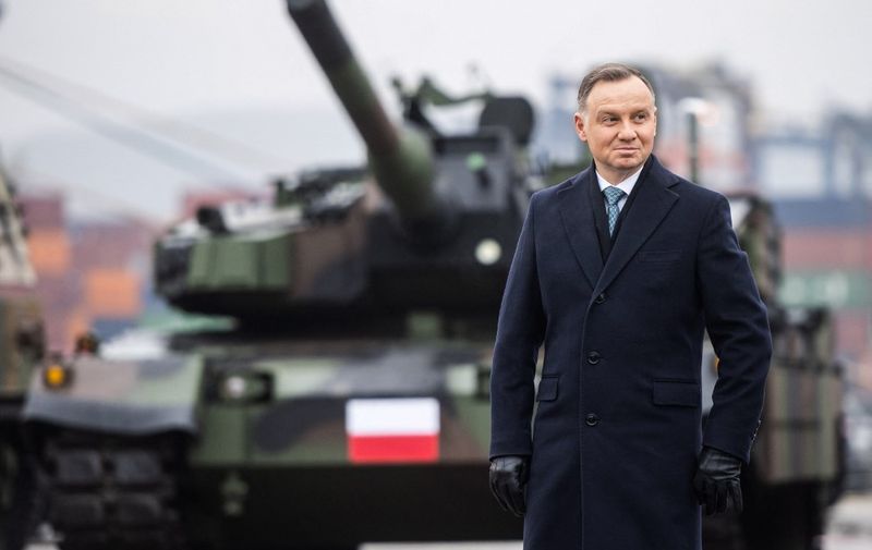 Polish President Andrzej Duda attends the acceptance of the first South Korean K2 battle tanks and South Korean K9 howitzers for Poland in December 6, 2022 at the Baltic Container Terminal in Gdynia. The Polish Army is strengthening its potential with the use of South Korean defense technologies. In July this year an agreement was concluded with Hyundai Rotem for the acquisition of a total of 1,000 K2 tanks with accompanying vehicles. (Photo by MATEUSZ SLODKOWSKI / AFP)