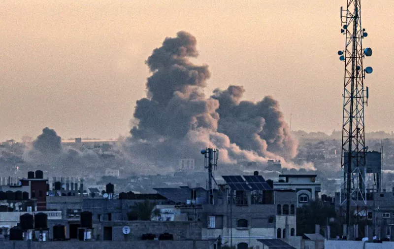 A picture taken from Rafah shows smoke billowing over Khan Yunis in the southern Gaza Strip during Israeli bombardment, as the war between Israel and the Palestinian militant group Hamas enters its 100th day on January 14, 2024 (Photo by AFP)