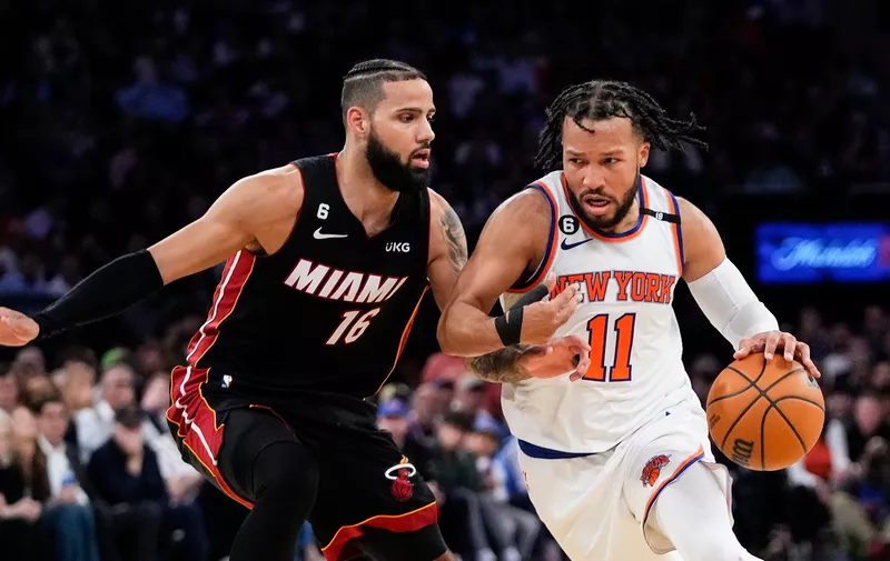 New York Knicks' Jalen Brunson (11) drives against Miami Heat's Caleb Martin (16) during the second half of Game 5 of an NBA basketball Eastern Conference playoff semifinal Wednesday, May 10, 2023, in New York. The Knicks won 112-103. (AP Photo/Frank Franklin II)