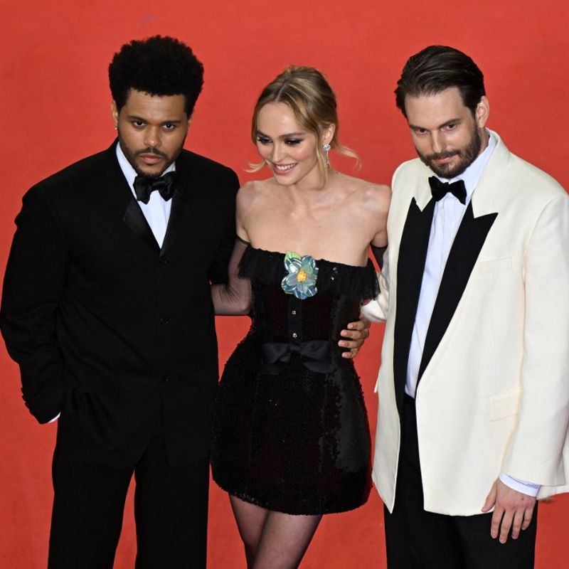 (From L) Canadian singer Abel Makkonen Tesfaye aka The Weeknd, French-US actress Lily-Rose Depp and US director Sam Levinson arrive for the screening of the film "The Idol" during the 76th edition of the Cannes Film Festival in Cannes, southern France, on May 22, 2023. (Photo by Antonin THUILLIER / AFP)