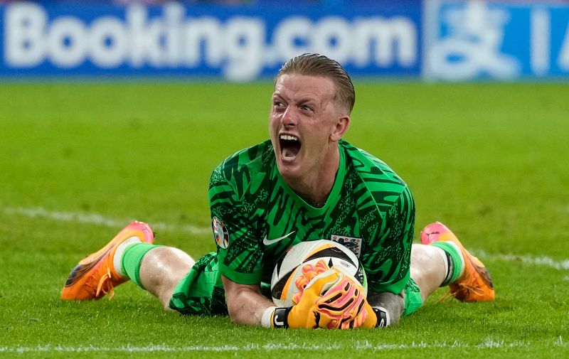 England's goalkeeper Jordan Pickford celebrates at the end of the round of sixteen match between England and Slovakia at the Euro 2024 soccer tournament in Gelsenkirchen, Germany, Sunday, June 30, 2024. (AP Photo/Antonio Calanni)