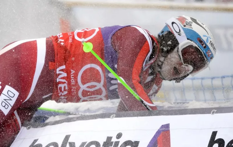 Norway's Henrik Kristoffersen crashes in the arrival area after winning the Alpine skiing FIS World Cup men's slalom event on January 17, 2016 in Wengen.   / AFP / FABRICE COFFRINI
