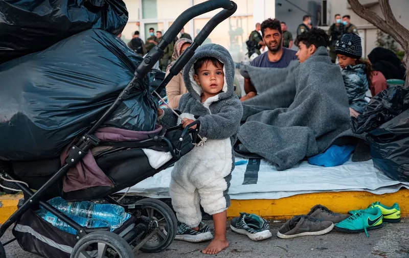Little children are among the refugees sleeping on roadside after Moria fire.
More than 13,000 Asylum seekers  flee fire at Greece's largest migrant Moira camp at lesbos. They have been stranded on the street before the town of mitilini and prevented to enter the harbour by police.
Migrants flee following a fire at Moria camp in Lesvos, Greece - 11 Sept 2020,Image: 557985410, License: Rights-managed, Restrictions: , Model Release: no