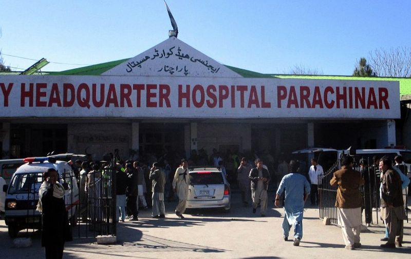 Pakistani paramedics and residents gather outside a hospital after a bomb explosion at a market in Parachinar, the capital of Kurram tribal district, on December 13, 2015. At least 10 people were killed and 30 wounded when a bomb ripped through a crowded Sunday bazaar in a mainly Shiite area of Pakistan's northwestern tribal region, officials said, with the death toll feared to rise. AFP PHOTO / IRFAN BURKI / AFP / IRFAN BURKI