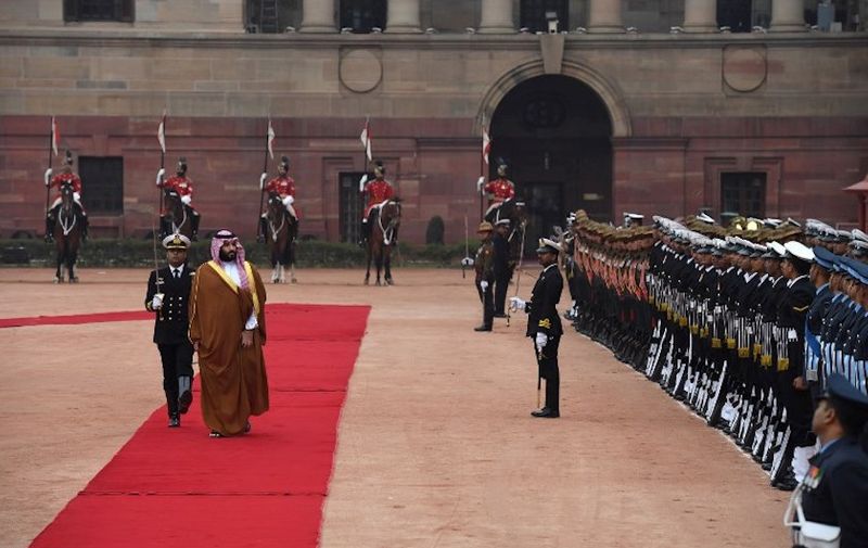 Saudi Crown Prince Mohammed bin Salman (2nd L) inspects a guard of honour during a ceremonial reception at the presidential palace in New Delhi on February 20, 2019. (Photo by PRAKASH SINGH / AFP)