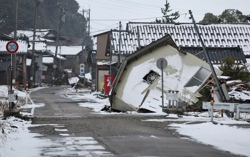 A photo shows a disaster-stricken area damaged by a massive earthquake in Nanao City, Ishikawa Prefecture on January 25, 2024. The strong earthquake of magnitude 7.6 hit the Noto peninsula of Ishikawa Prefecture, central Japanese main island, on Jan. 1st. The affected area is covered with snow.( The Yomiuri Shimbun ) (Photo by Fuminori Ogane / Yomiuri / The Yomiuri Shimbun via AFP)