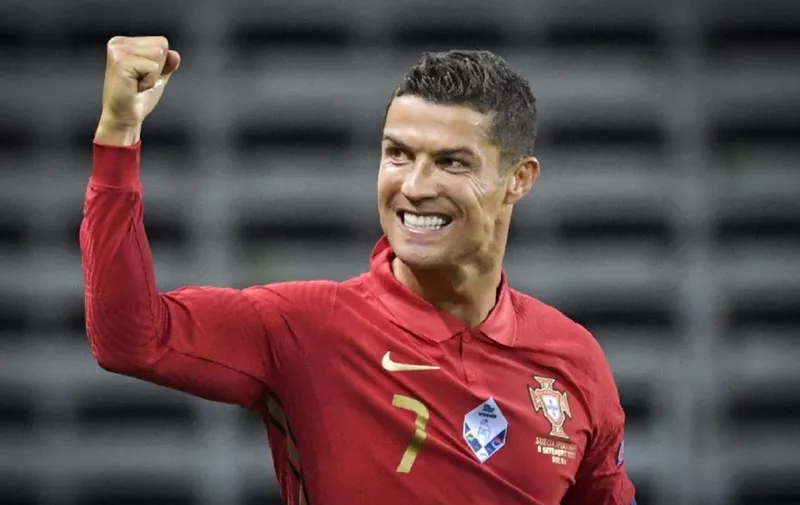 Portugal's forward Cristiano Ronaldo celebrates scoring the opening goal, his 100th goal for Portugal, during the UEFA Nations League football match between Sweden and Portugal on September 8, 2020 in Solna, Sweden. (Photo by Janerik HENRIKSSON / TT NEWS AGENCY / AFP) / Sweden OUT