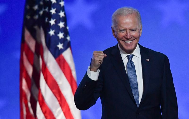 (FILES) In this file photo taken early on November 4, 2020 Democratic presidential nominee Joe Biden gestures after speaking during election night at the Chase Center in Wilmington, Delaware. - Joe Biden has won the US presidency over Donald Trump, TV networks projected on November 7, 2020, a victory sealed after the Democrat claimed several key battleground states won by the Republican incumbent in 2016. CNN, NBC News and CBS News called the race in his favor, after projecting he had won the decisive state of Pennsylvania. His running mate, US Senator Kamala Harris, has become the first woman US Vice President elected to the office. (Photo by ANGELA  WEISS / AFP)