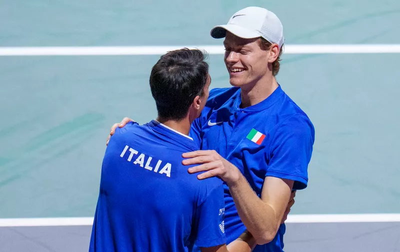 Italy's Jannik Sinner, right, celebrates with his teammate Lorenzo Sonego after winning against Serbia's Novak Djokovic and Miomir Kecmanovic during a Davis Cup semi-final doubles tennis match between Italy and Serbia in Malaga, Spain, Saturday, Nov. 25, 2023. (AP Photo/Manu Fernandez)