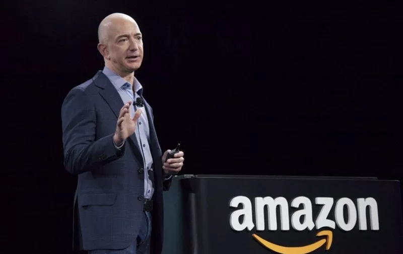 SEATTLE, WA - JUNE 18: Amazon.com founder and CEO Jeff Bezos presents the company's first smartphone, the Fire Phone, on June 18, 2014 in Seattle, Washington. The much-anticipated device is available for pre-order today and is available exclusively with AT&amp;T service.   David Ryder/Getty Images/AFP
