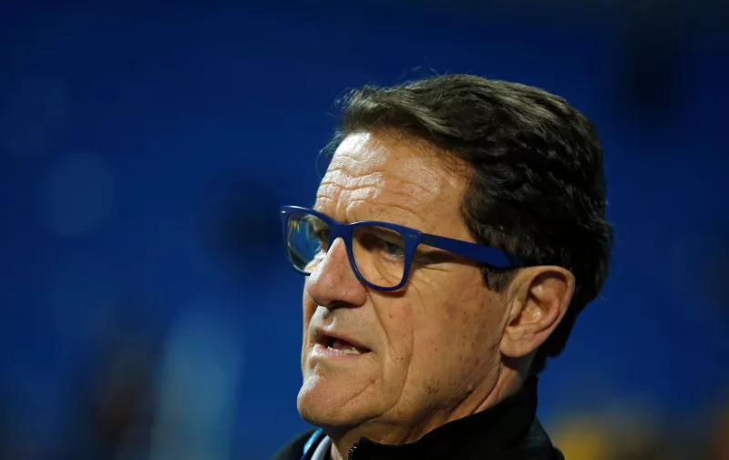 Former Real Madrid coach Fabio Capello waits to be interviewed by a TV crew before a Spanish La Liga soccer match between Real Madrid and Las Palmas at the Santiago Bernabeu stadium in Madrid, Spain, Wednesday March 1, 2017. (AP Photo/Paul White)
