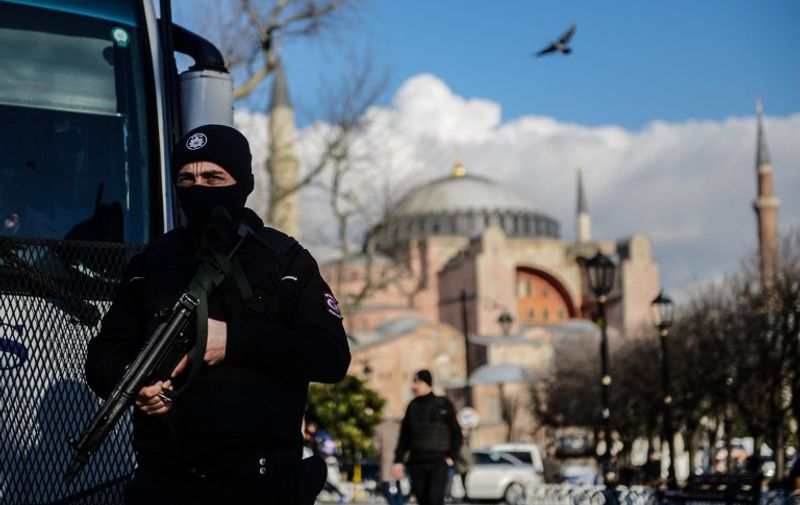 A Turkish riot police stands guard on January 14, 2016 on the site of the January 12 attacks at the Istanbul's tourist hub of Sultanahmet. 
Turkey said on January 13 it had arrested a total of five suspects over the deadly suicide bombing carried out by an Islamic State (IS) jihadist that killed 10 German tourists in the historic centre of Istanbul.  / AFP / OZAN KOSE