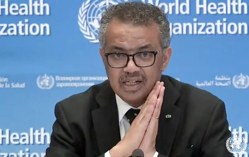A tv grab taken from the World Health Organization website shows WHO Chief Tedros Adhanom Ghebreyesus delivering a virtual news briefing on COVID-19 (novel coronavirus) at the WHO headquarters in Geneva on March 23, 2020. - The new coronavirus pandemic is clearly "accelerating", WHO chief warned on March 23, 2020, but stressed it was still possible to "change the trajectory" of the outbreak. (Photo by - / AFP)