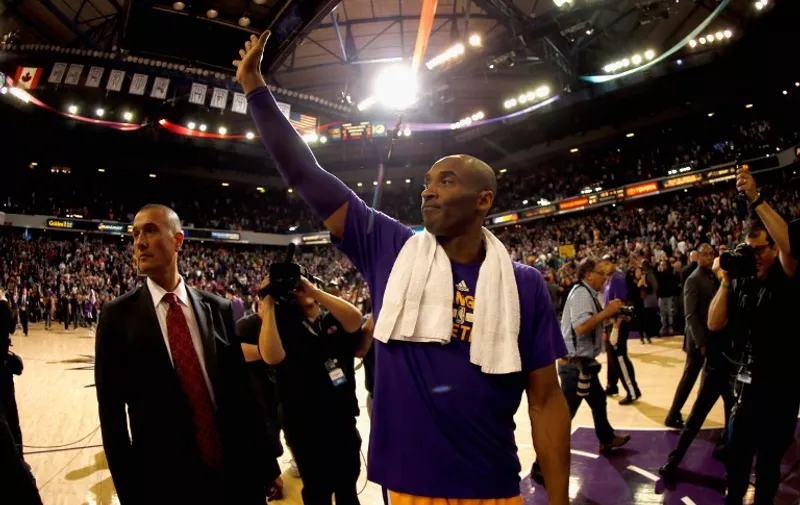 SACRAMENTO, CA - JANUARY 07: Kobe Bryant #24 of the Los Angeles Lakers waves to the crowd after their game against the Sacramento Kings at Sleep Train Arena on January 7, 2016 in Sacramento, California. NOTE TO USER: User expressly acknowledges and agrees that, by downloading and or using this photograph, User is consenting to the terms and conditions of the Getty Images License Agreement.   Ezra Shaw/Getty Images/AFP