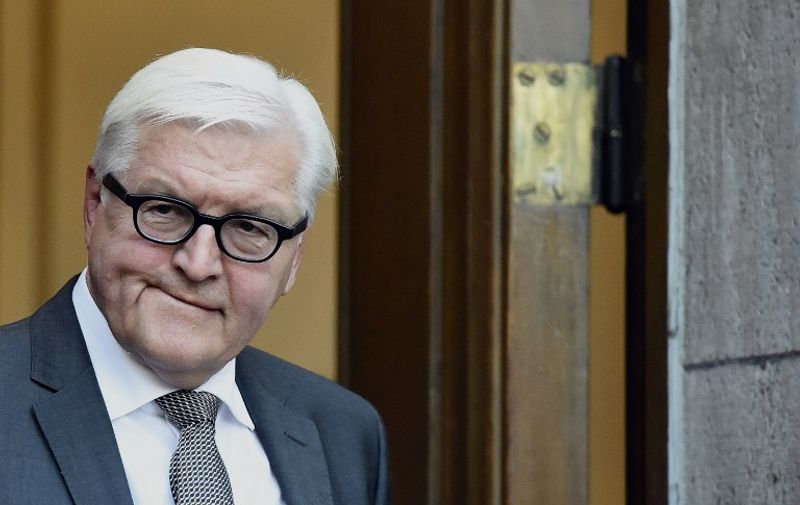 German Foreign Minister Frank-Walter Steinmeier arrives for a statement ahead of a meeting with his Russian, French and Ukrainian counterparts at the foreign ministry's Villa Borsig at lake Tegel in Berlin September 12, 2015. AFP PHOTO / POOL / TOBIAS SCHWARZ